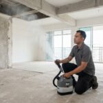 Professional vector control technician conducting pre-renovation ULV misting and fumigation in a resale Singapore apartment.